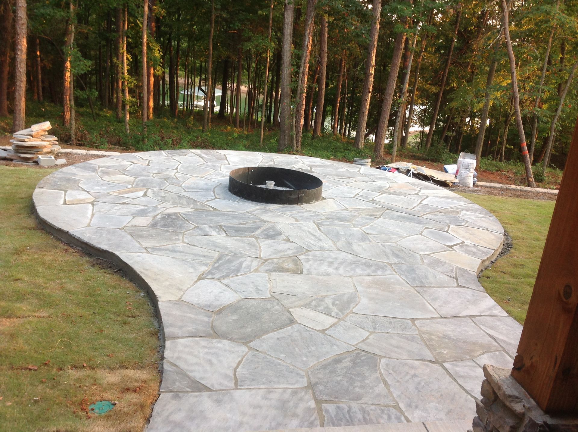 There is a fire pit in the middle of the patio.