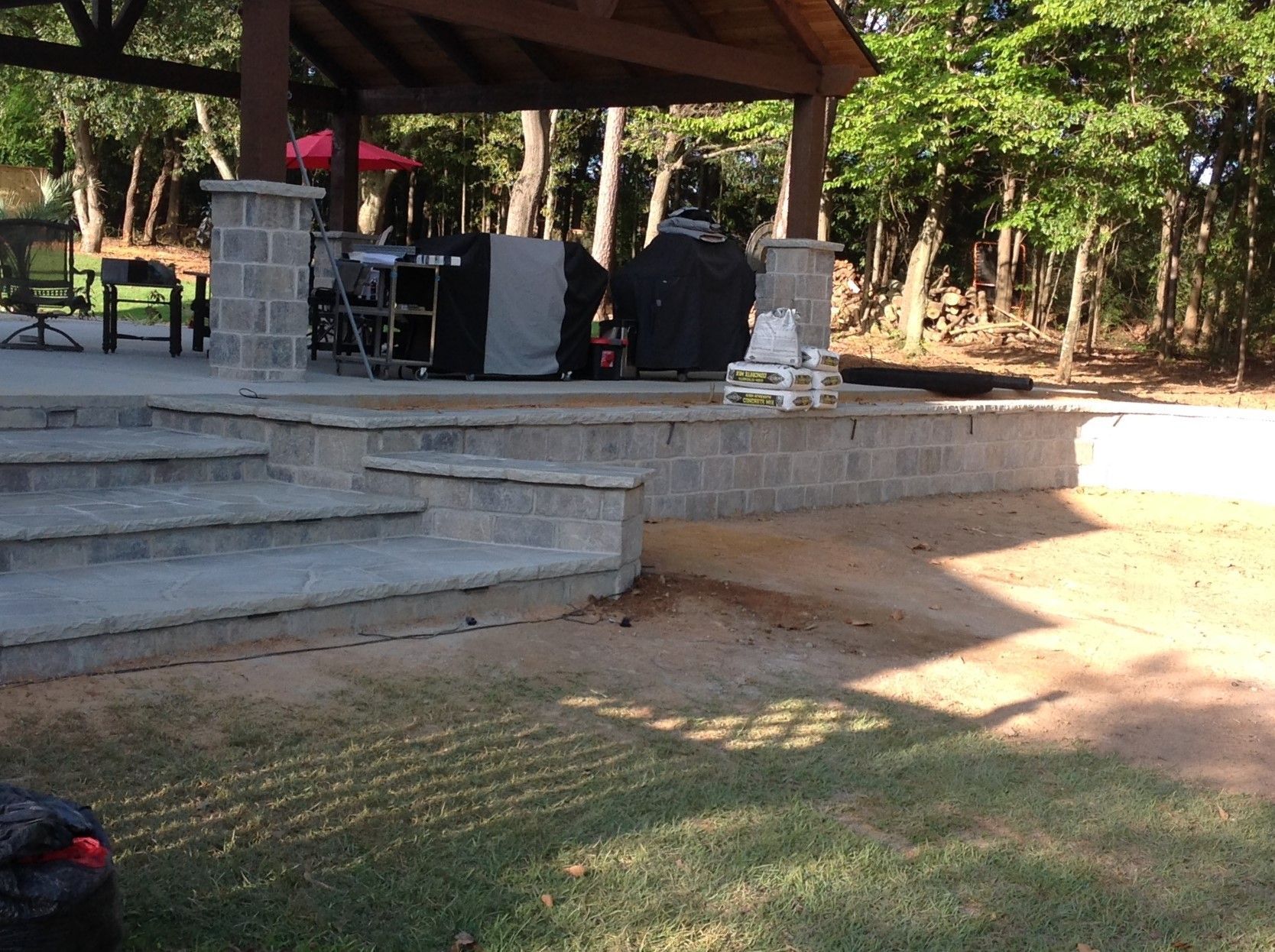 A stage with stairs leading up to it in a park