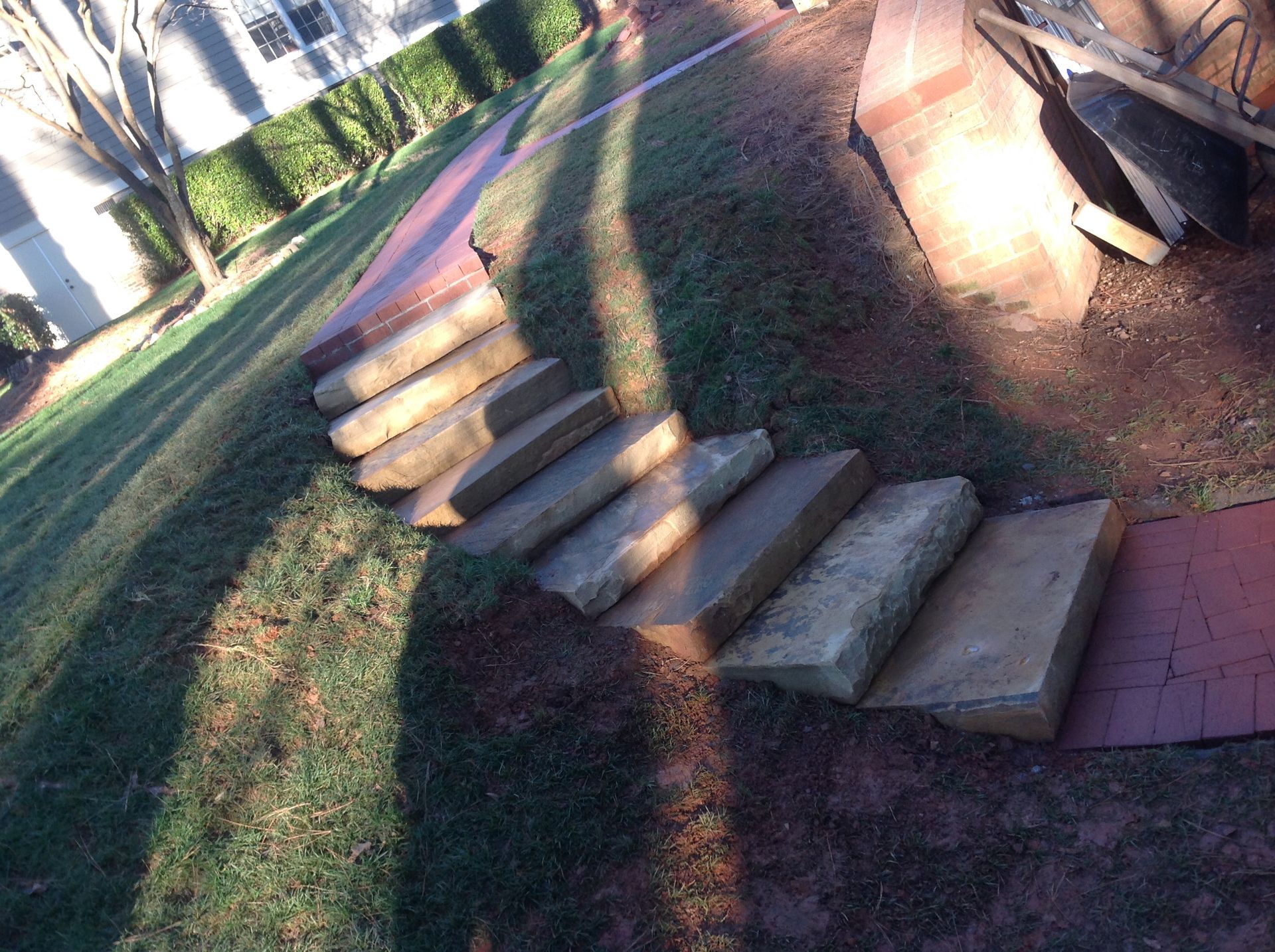 A row of stone steps leading up to a house