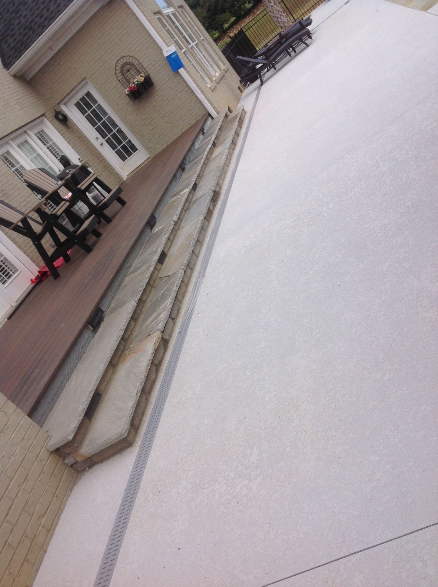 A house with a deck and stairs leading to it