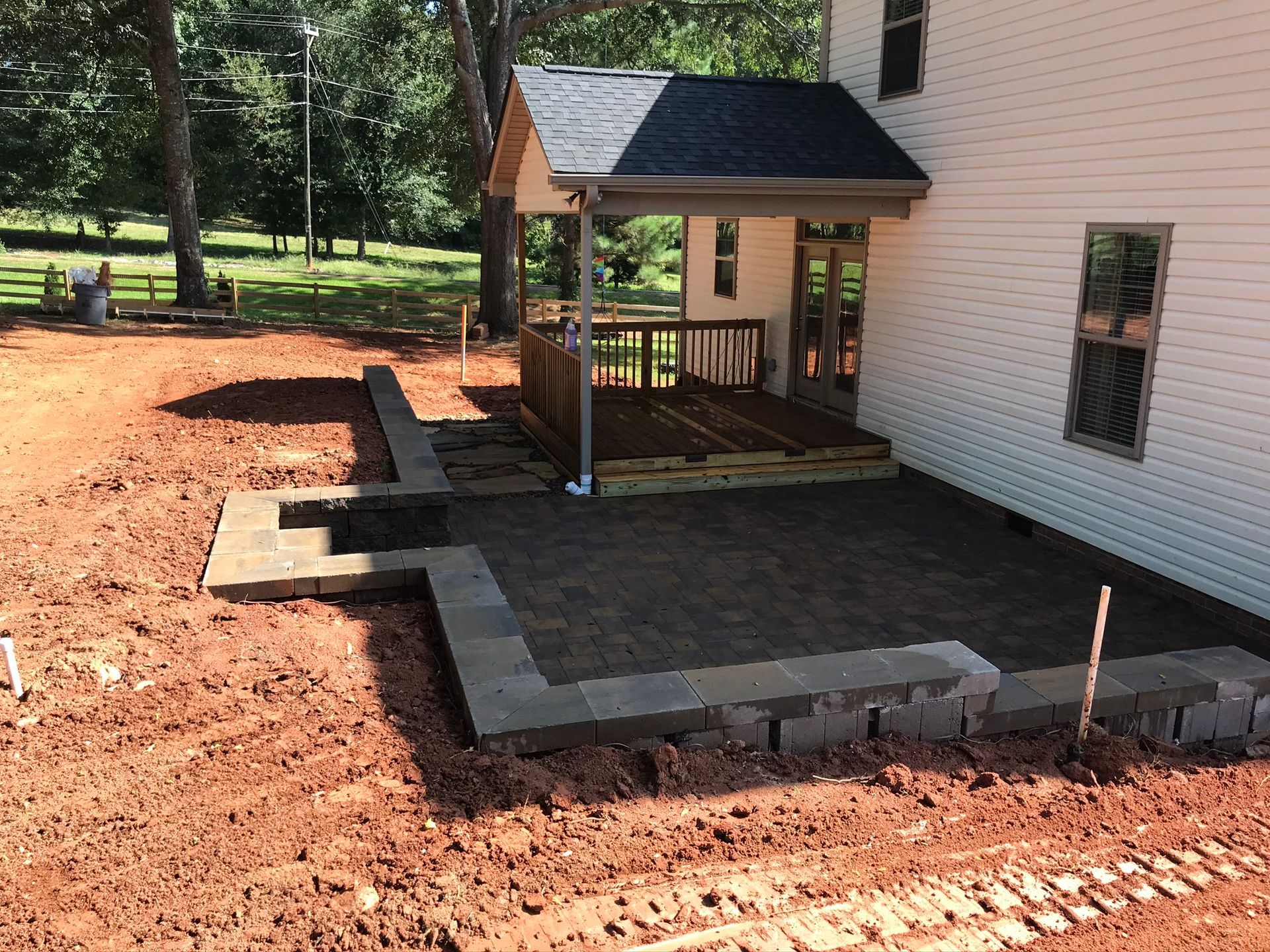 A white house with a patio in front of it