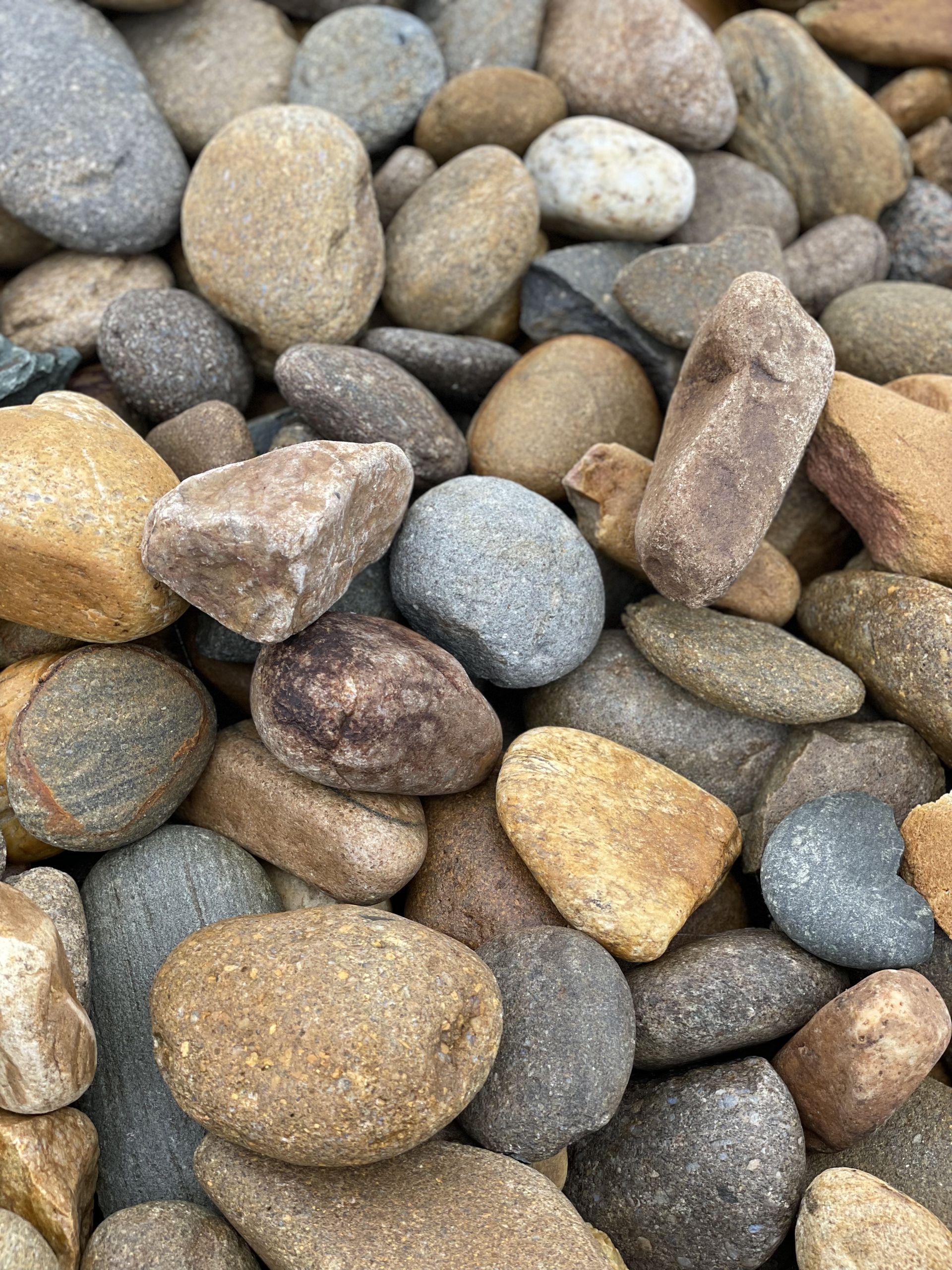 A pile of rocks of different sizes and colors.