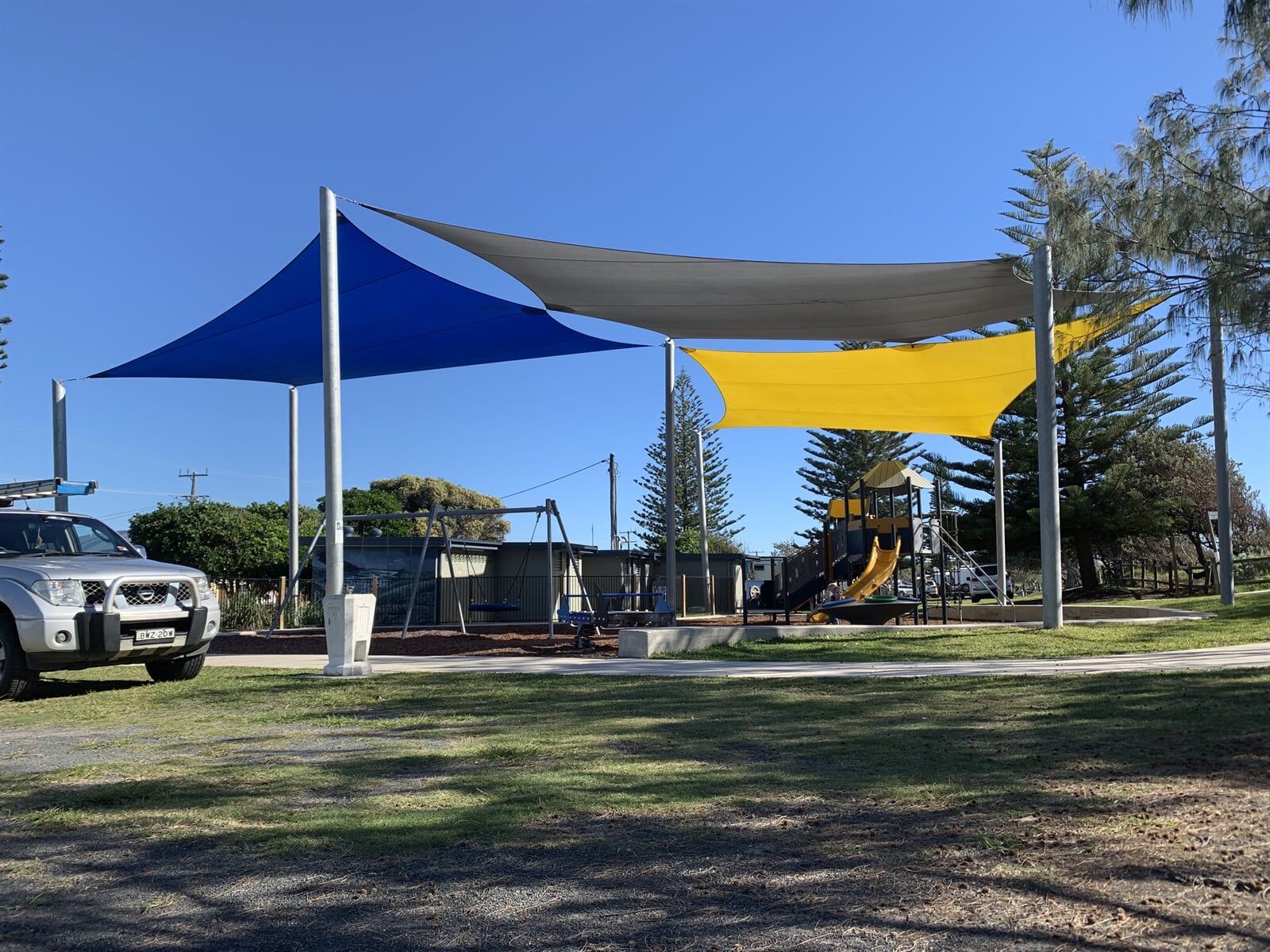 Blue, Yellow And Grey Shade Sails — Design & Fabrication of Shades in Grafton, NSW