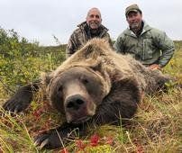 Grizzly hunter and guide with nice arctic grizzly