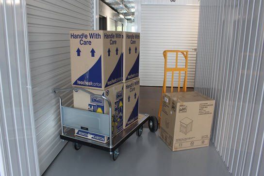 Boxes Getting Moved Into Storage Unit — Self Storage in Cooloola Cove QLD