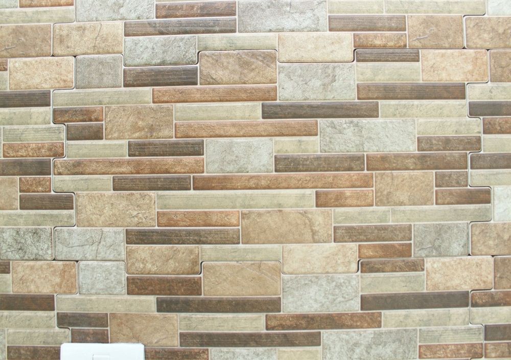 Zest Underfloor Heating Newcastle - fitted grey textured tiled feature wall in a living room