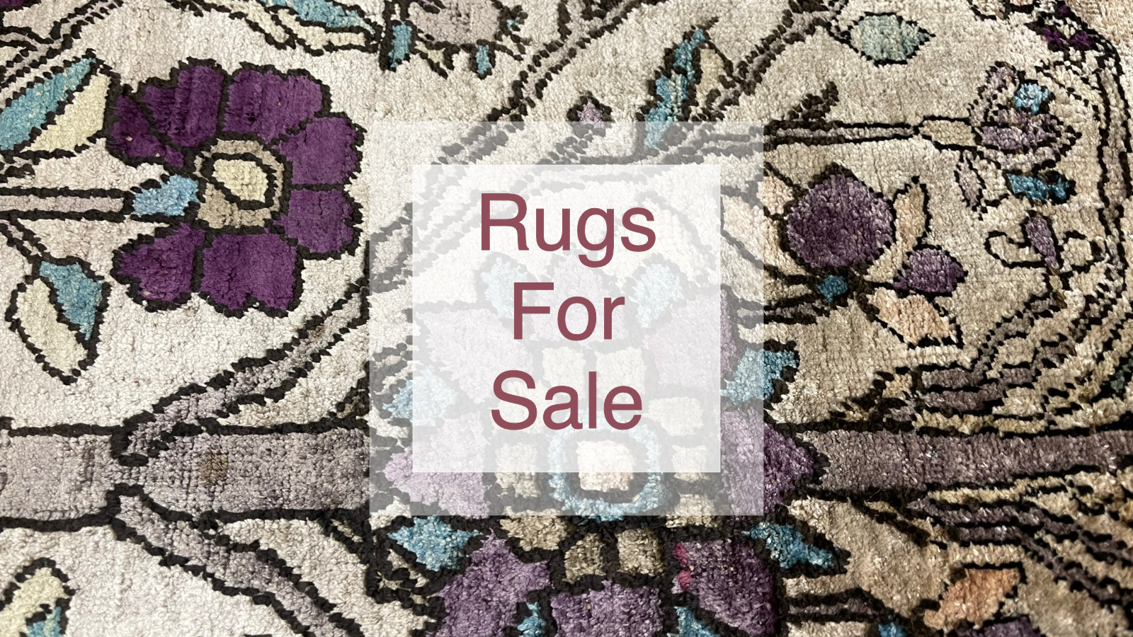A selection of rugs for sale.
