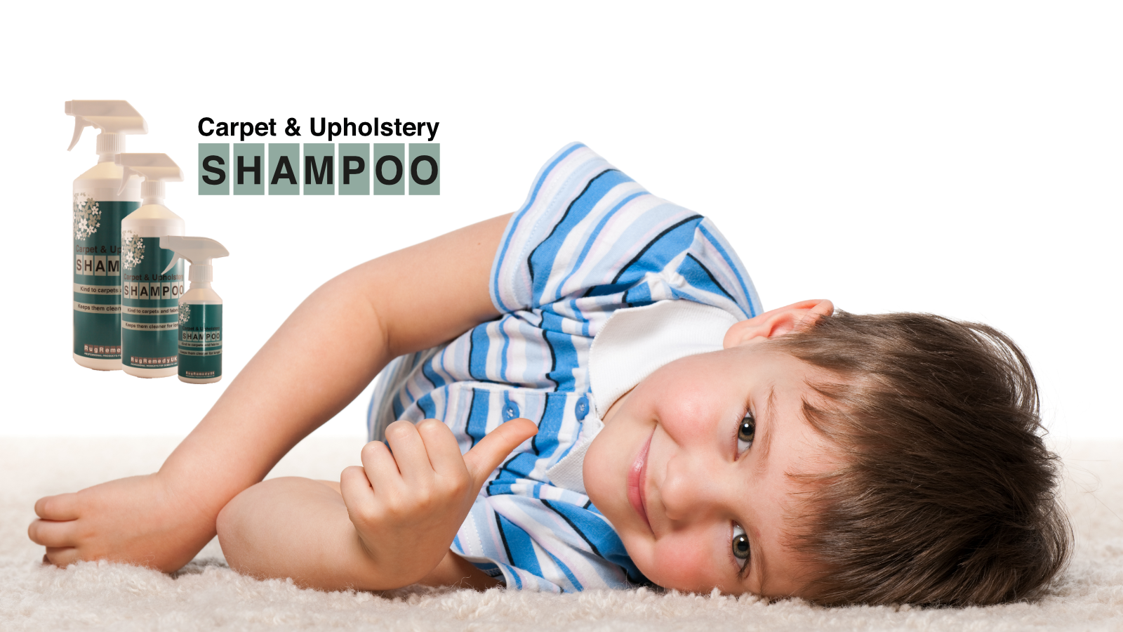 Keep your carpets fresh and clean. Little boy lying down on a carpet, on his side looking at the camera.