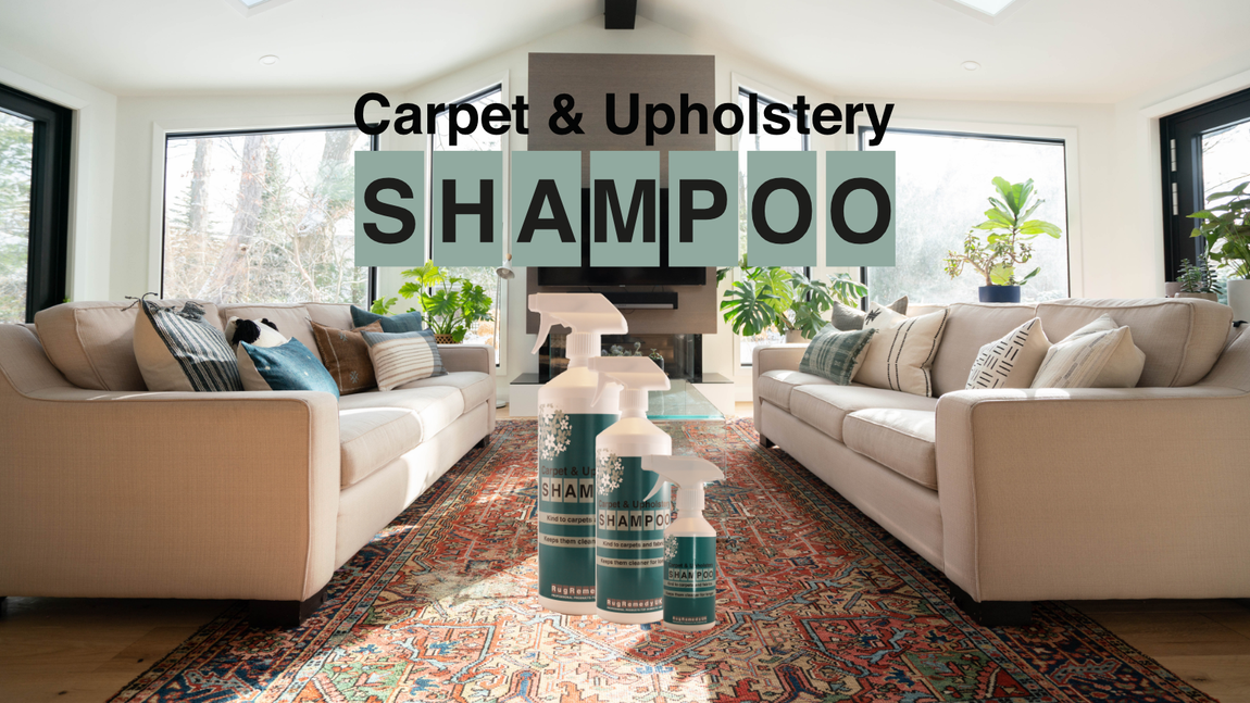 A little boy lying on a cream carpet doing a thumbs up with a bottle of Carpet and Upholstery Shampoo.