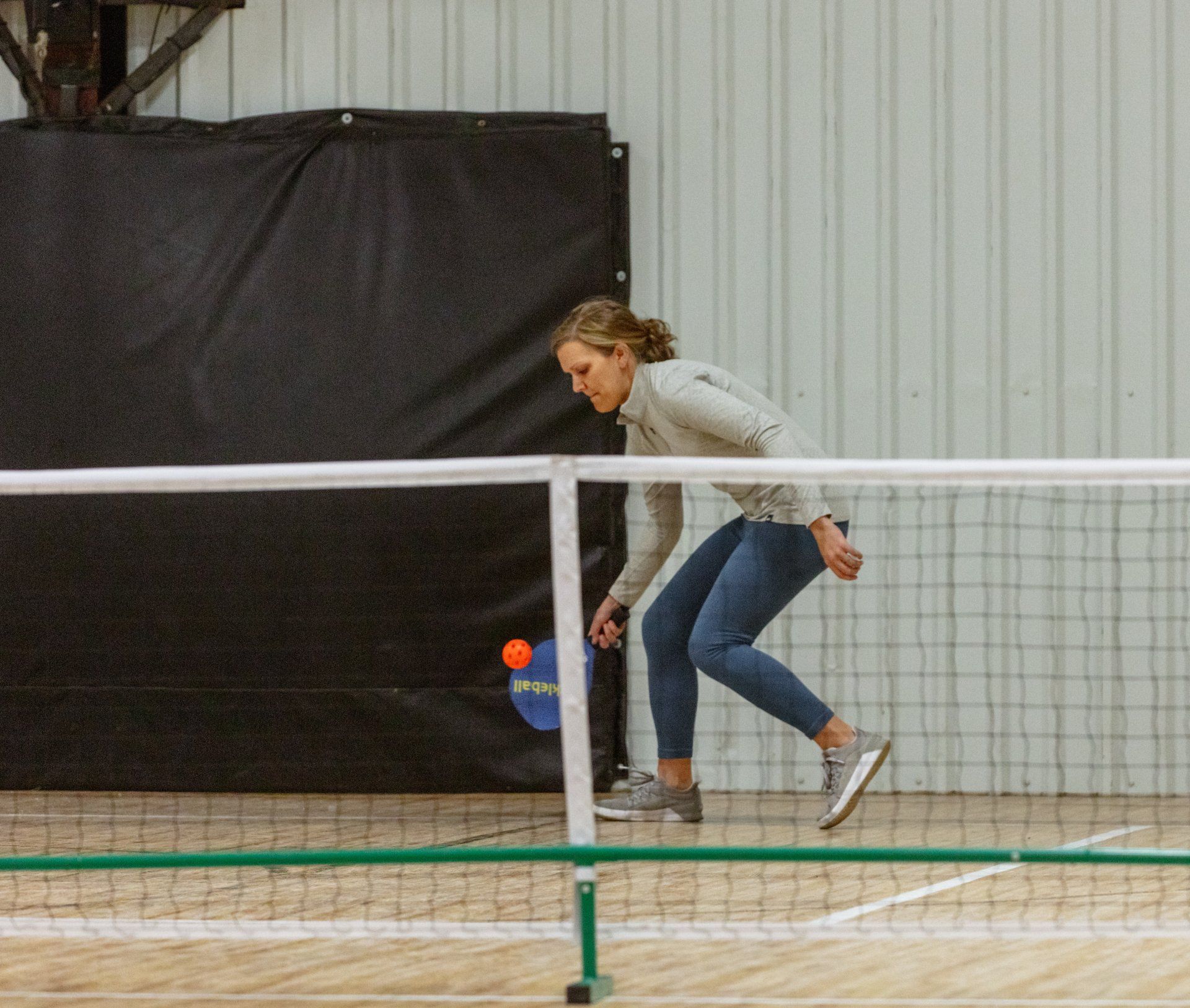 Woman Wearing Orange Playing  Pickleball — McAlester, OK — Pickle Palace