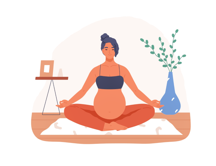 A pregnant woman is sitting in a lotus position on a yoga mat.