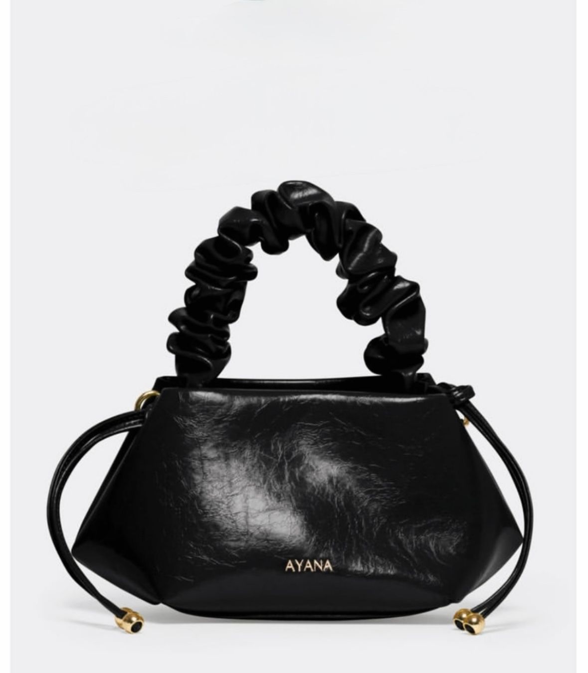 Black leather handbag with gathered handle, AYANA logo.