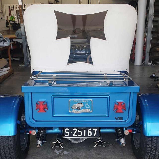 A Blue Car With a License Plate That Says S-25167 — Coastal Coverings In Smithfield, QLD