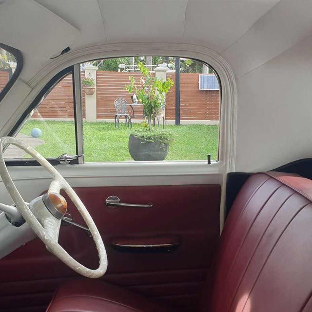 A Car With a Red Seat and a White Steering Wheel — Coastal Coverings In Smithfield, QLD