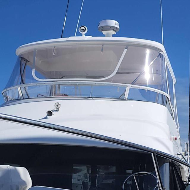 The Front of a White Boat With a Clear Windshield — Coastal Coverings In Smithfield, QLD