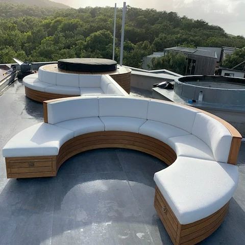 A Circular Couch is Sitting on Top of a Roof — Coastal Coverings In Smithfield, QLD