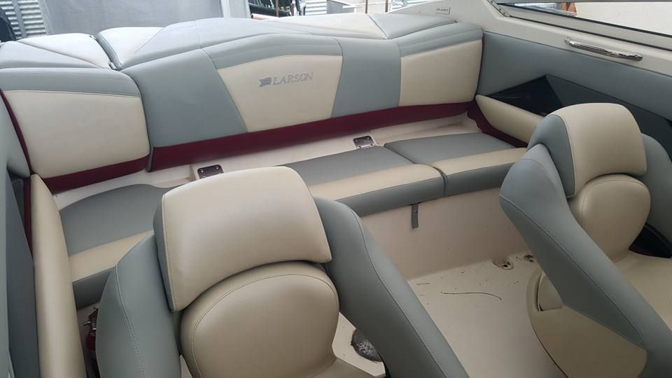 The Interior of a Boat With Gray and White Seats — Coastal Coverings In Smithfield, QLD