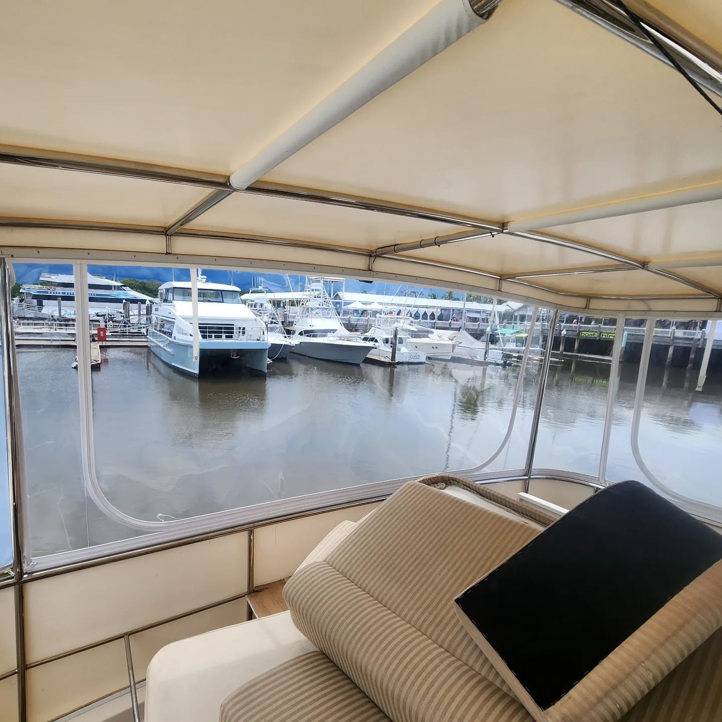 A Boat is Docked at a Marina With Boats in the Water — Coastal Coverings In Smithfield, QLD