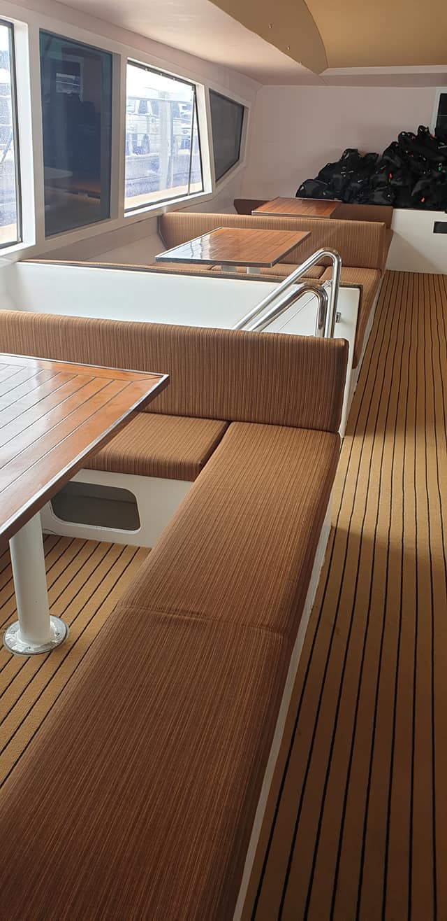 There Are Many Tables and Benches on the Boat — Coastal Coverings In Port Douglas, QLD