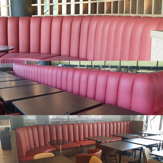 A Restaurant With a Long Pink Booth and Tables — Coastal Coverings In Smithfield, QLD