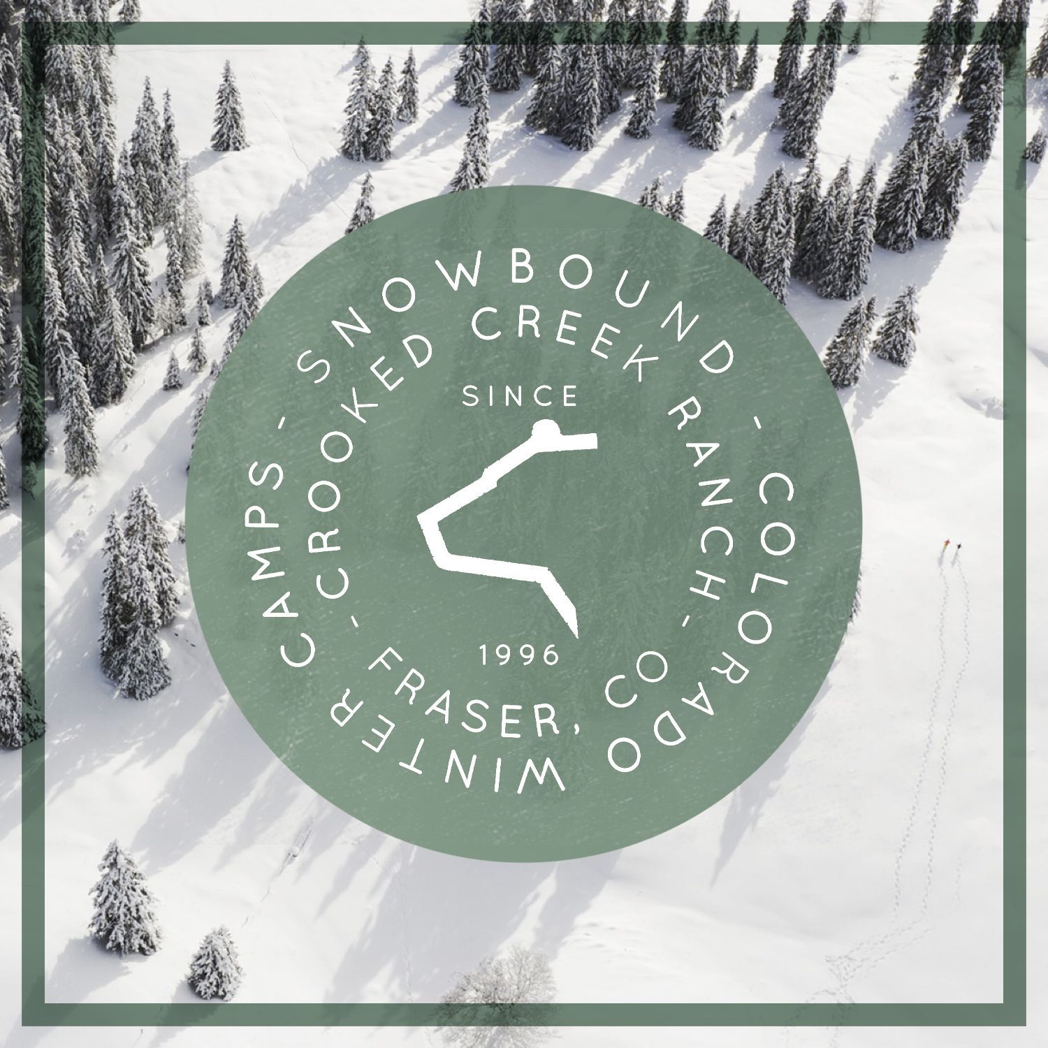 A snowbound logo with a bear and mountains