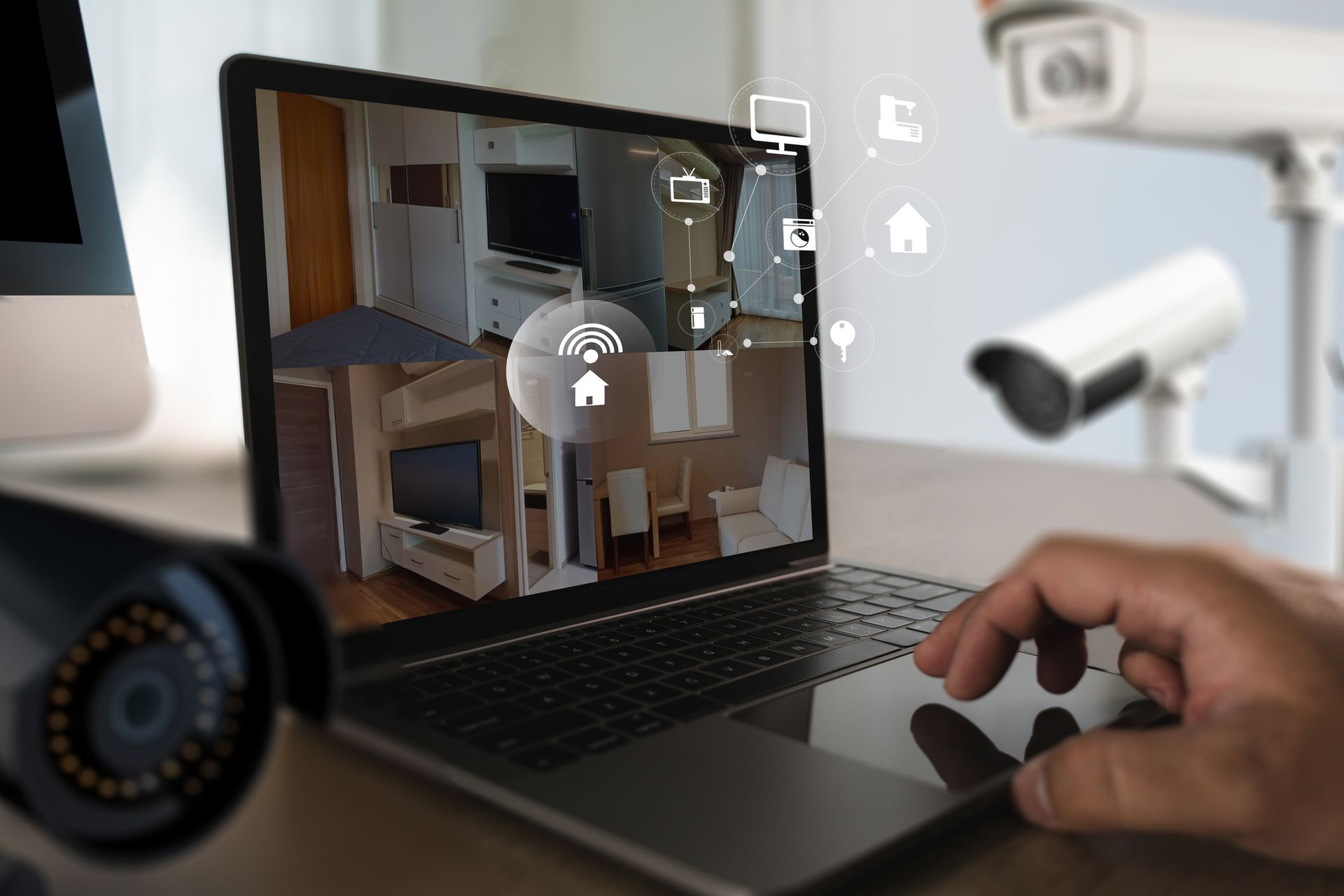 A computer , tablet , phone , and laptop are all connected to a security system. Multiple devices displaying security camera feeds: a desktop, laptop, tablet, and two smartphones. Views include a driveway, garage, and interior shots.