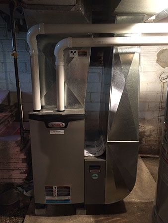 A heating and cooling system is installed in a basement.