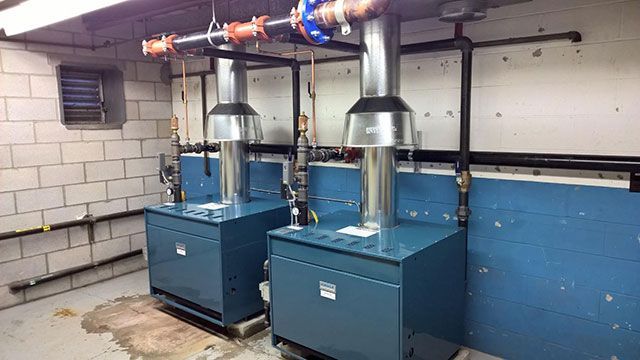 A basement with a furnace and air conditioner in it.