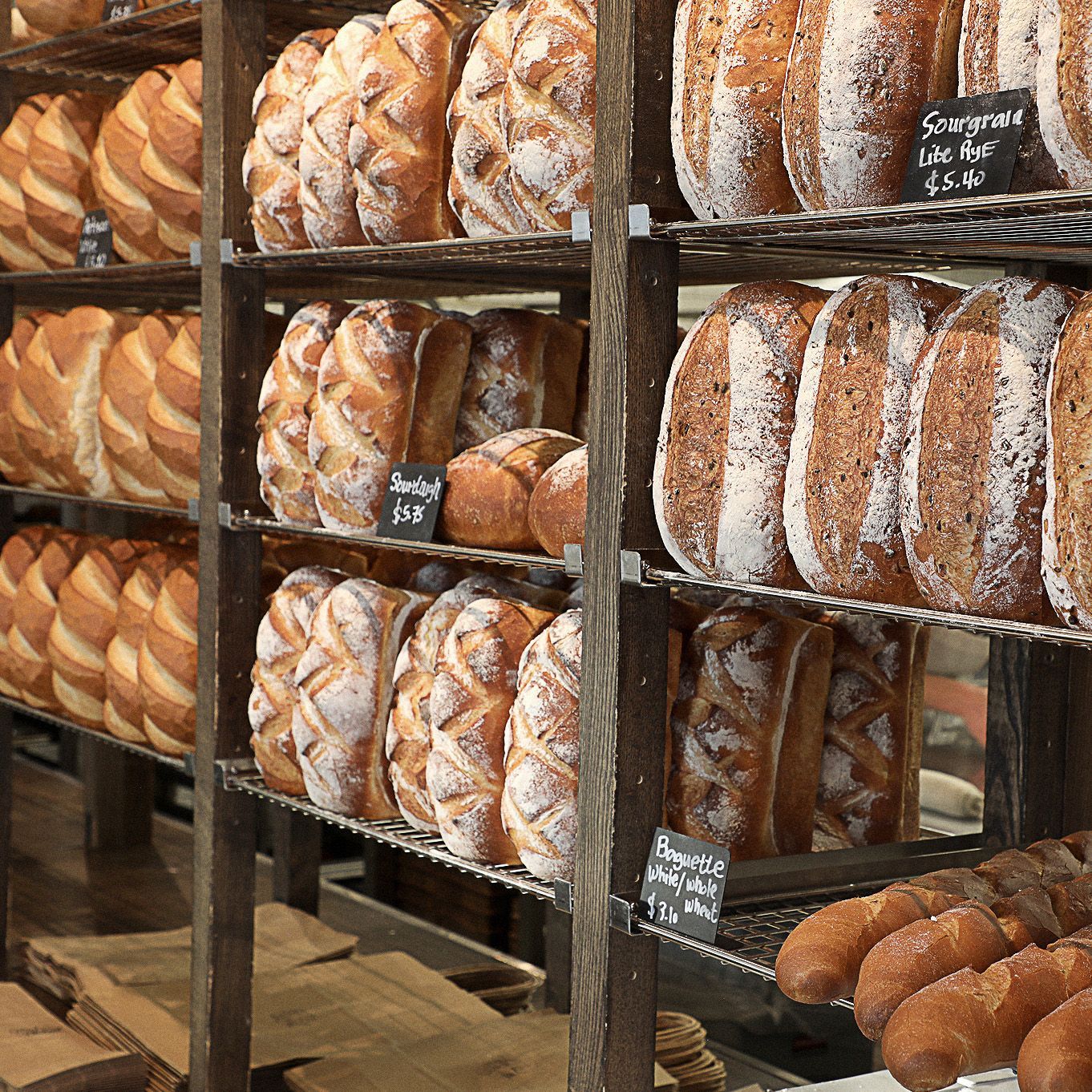 A variety of breads are on display in a bakery