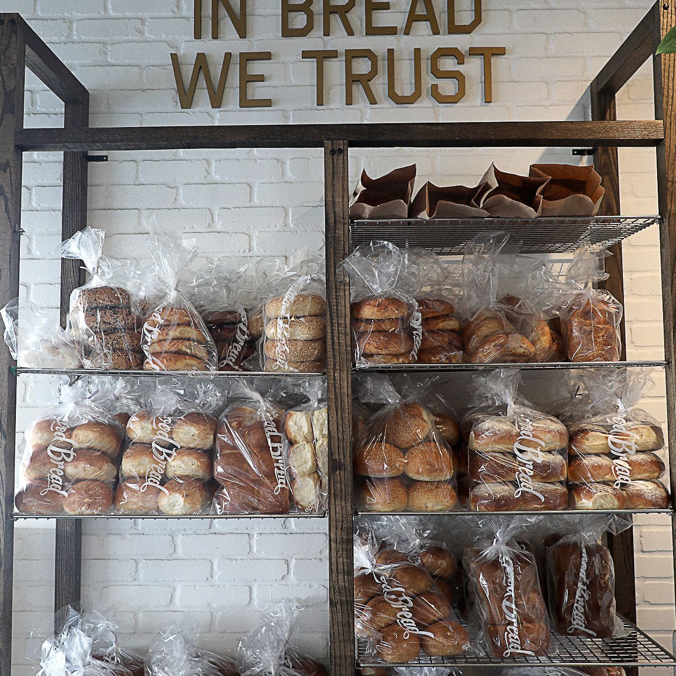 A bakery with a sign that says in bread we trust