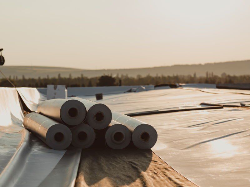 This photo shows a flat roof being installed by Southern Roofing Systems