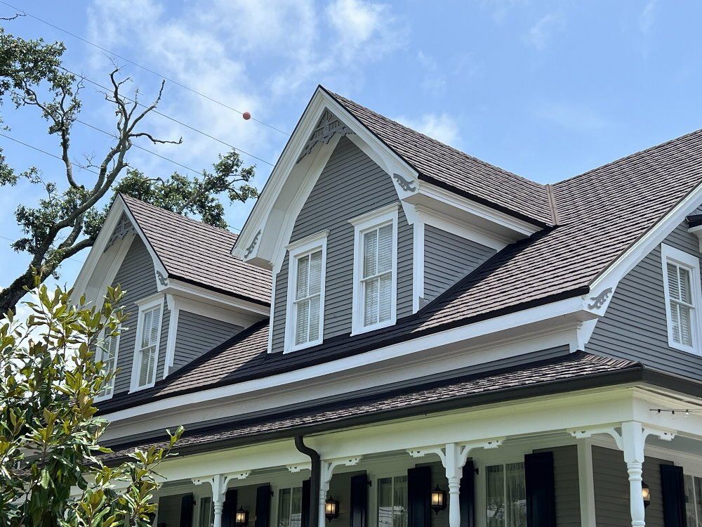 A photograph of a lovely new luxury shingle Roof replacement completed in Mobile, Alabama, for a local charity