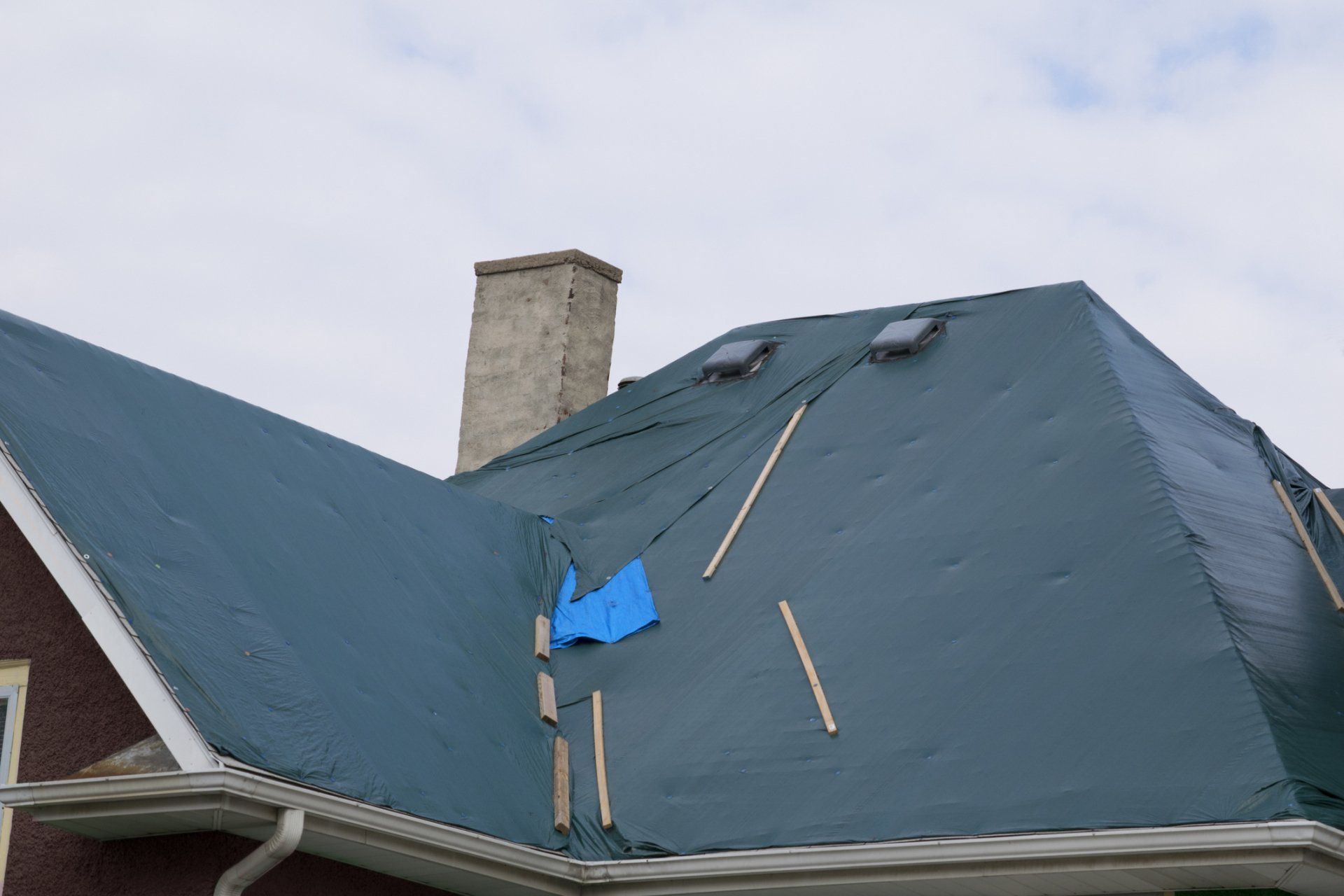 How to Tarp a Roof and How to Know When You Should