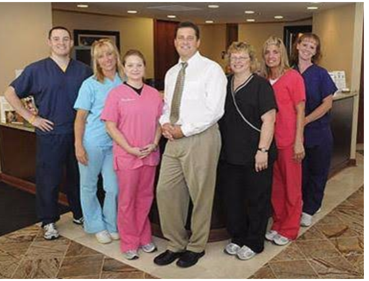 A group of nurses and doctors posing for a picture