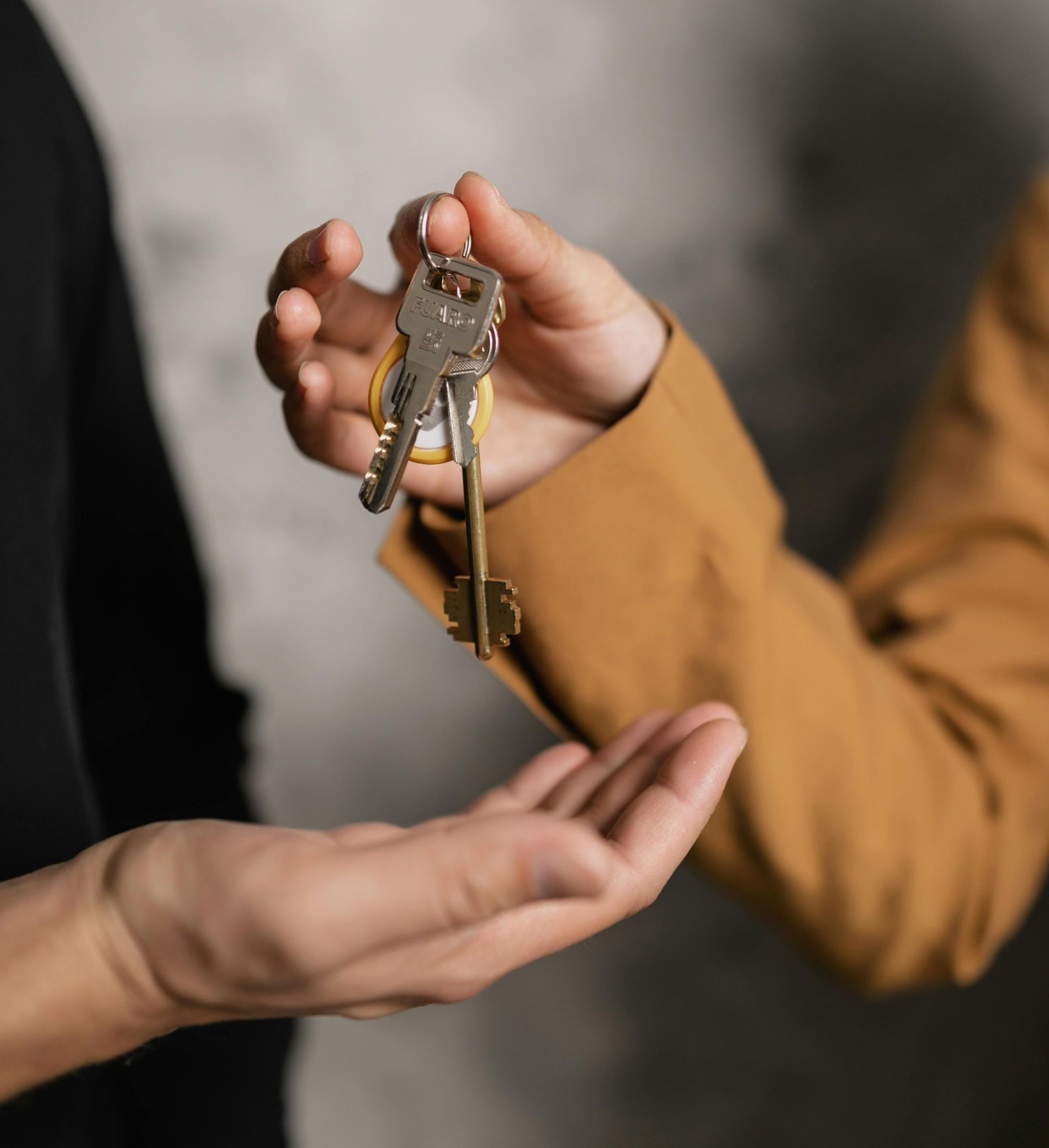 A person is holding a bunch of keys in their hands