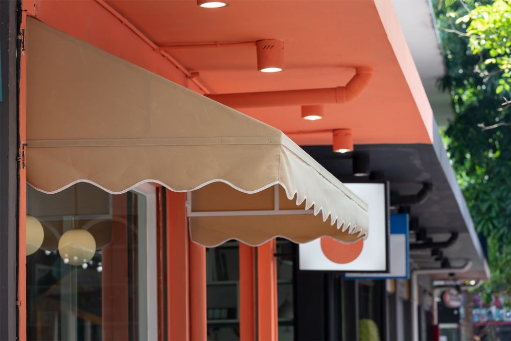 A Close Up Of An Awning On A Orange Building— Lismore Curtains & Blinds In Ballina, NSW
