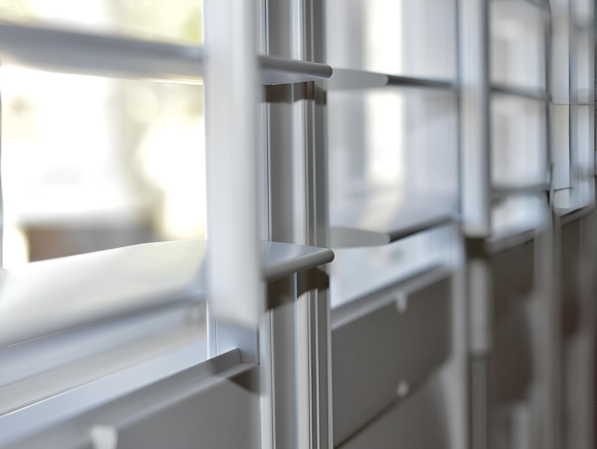 A Close Up of a Window With a Metal Railing — Lismore Curtains & Blinds In Byron Bay, NSW