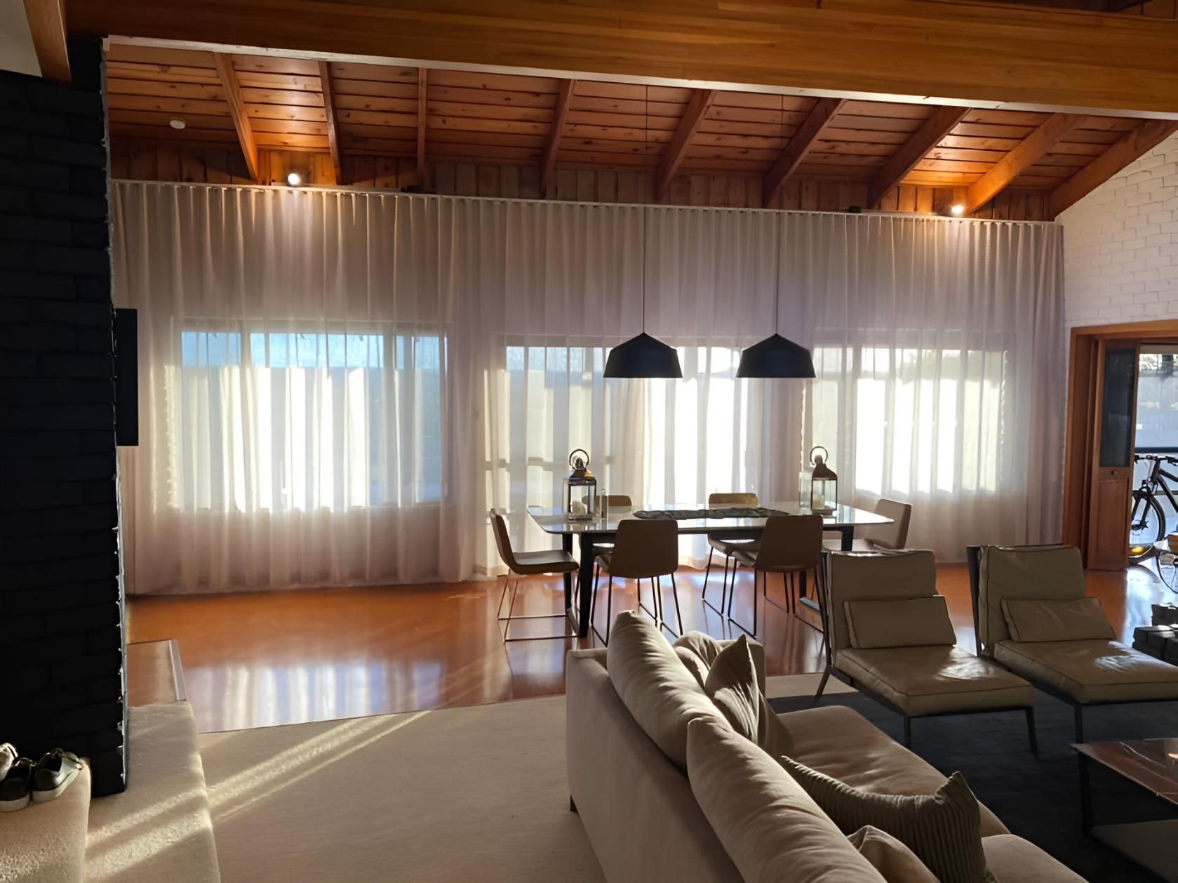 A Living Room With a Couch , Chairs , Table and Curtains — Lismore Curtains & Blinds In Byron Bay, NSW