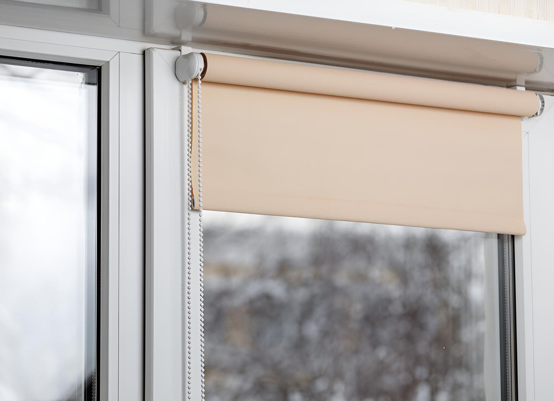 A Close Up of a Window With a Roller Blind on It — Lismore Curtains & Blinds In Casino, NSW