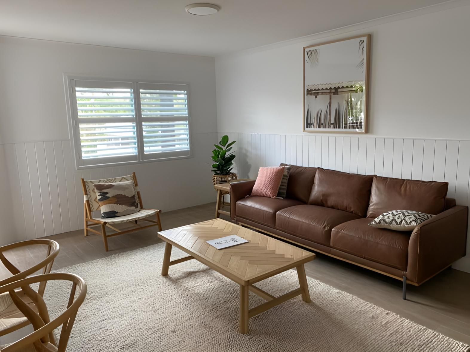 A Room With Leather Couch and a Wooden Coffee Table — Lismore Curtains & Blinds In Casino, NSW