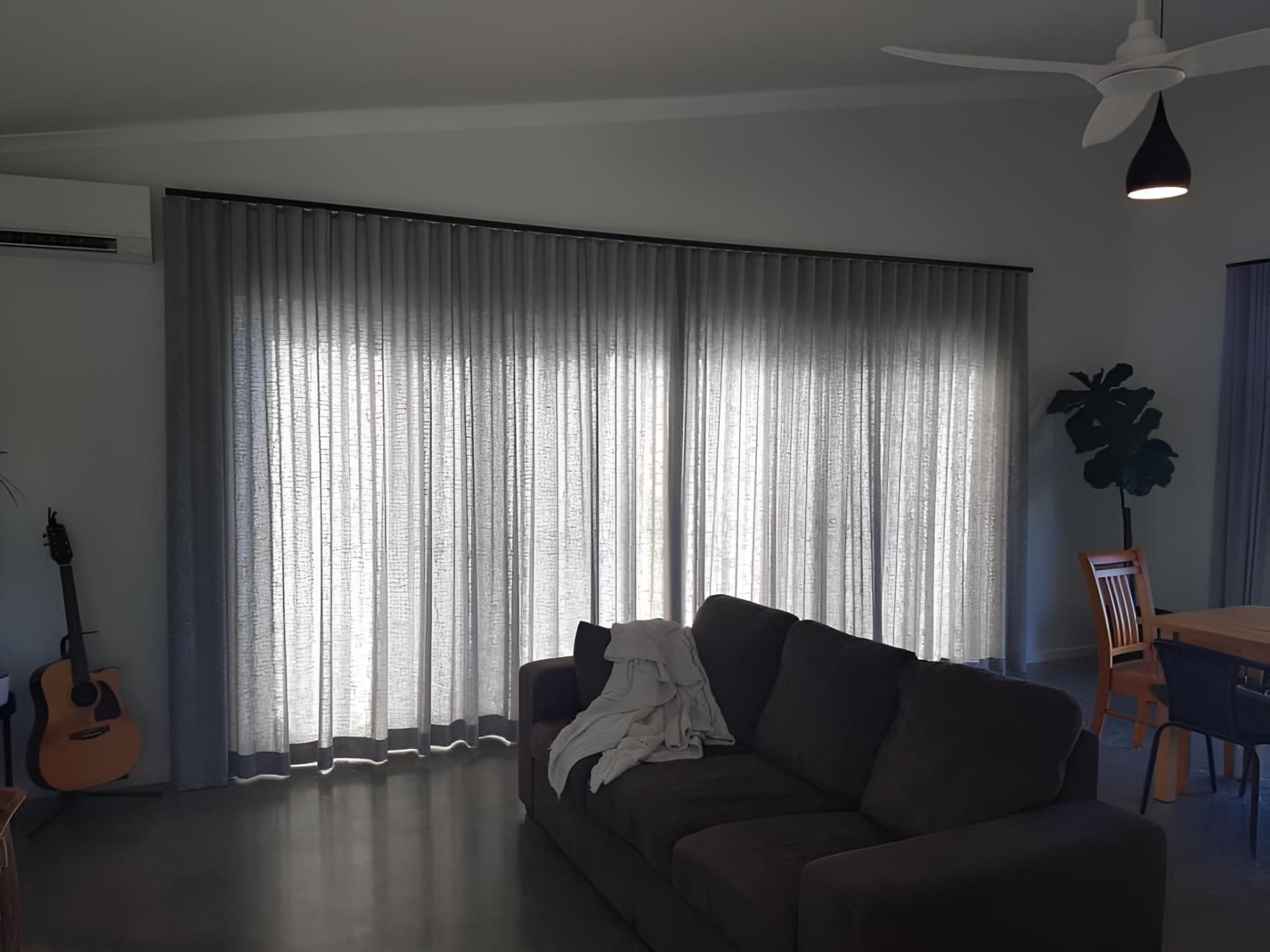 A Living Room With a Couch , Curtains and a Ceiling Fan — Lismore Curtains & Blinds In Casino, NSW