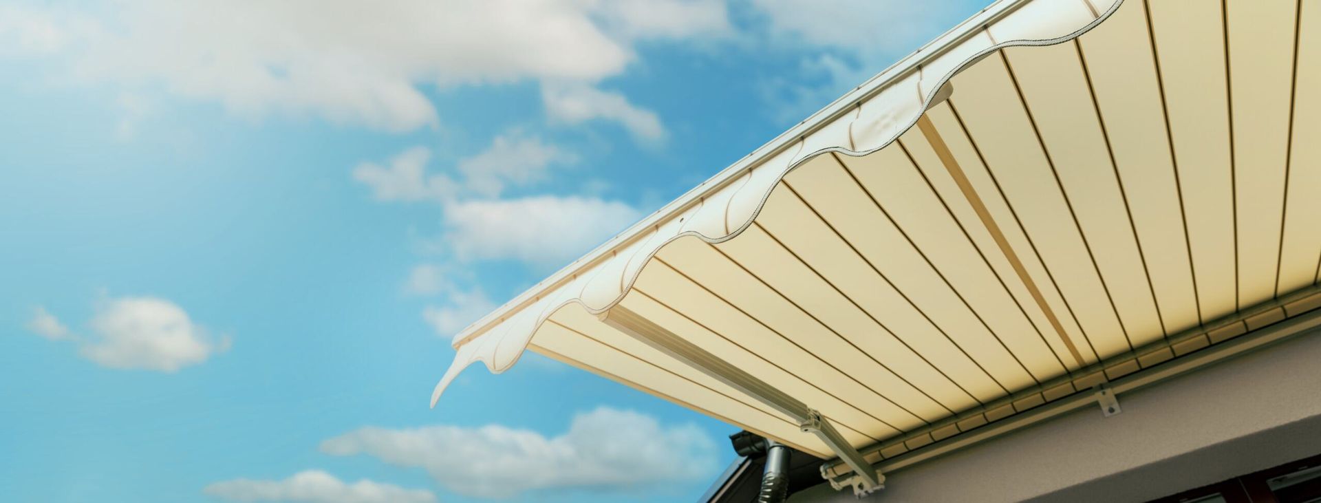 A White Awning on the Roof of a Building — Lismore Curtains & Blinds In Lismore, NSW
