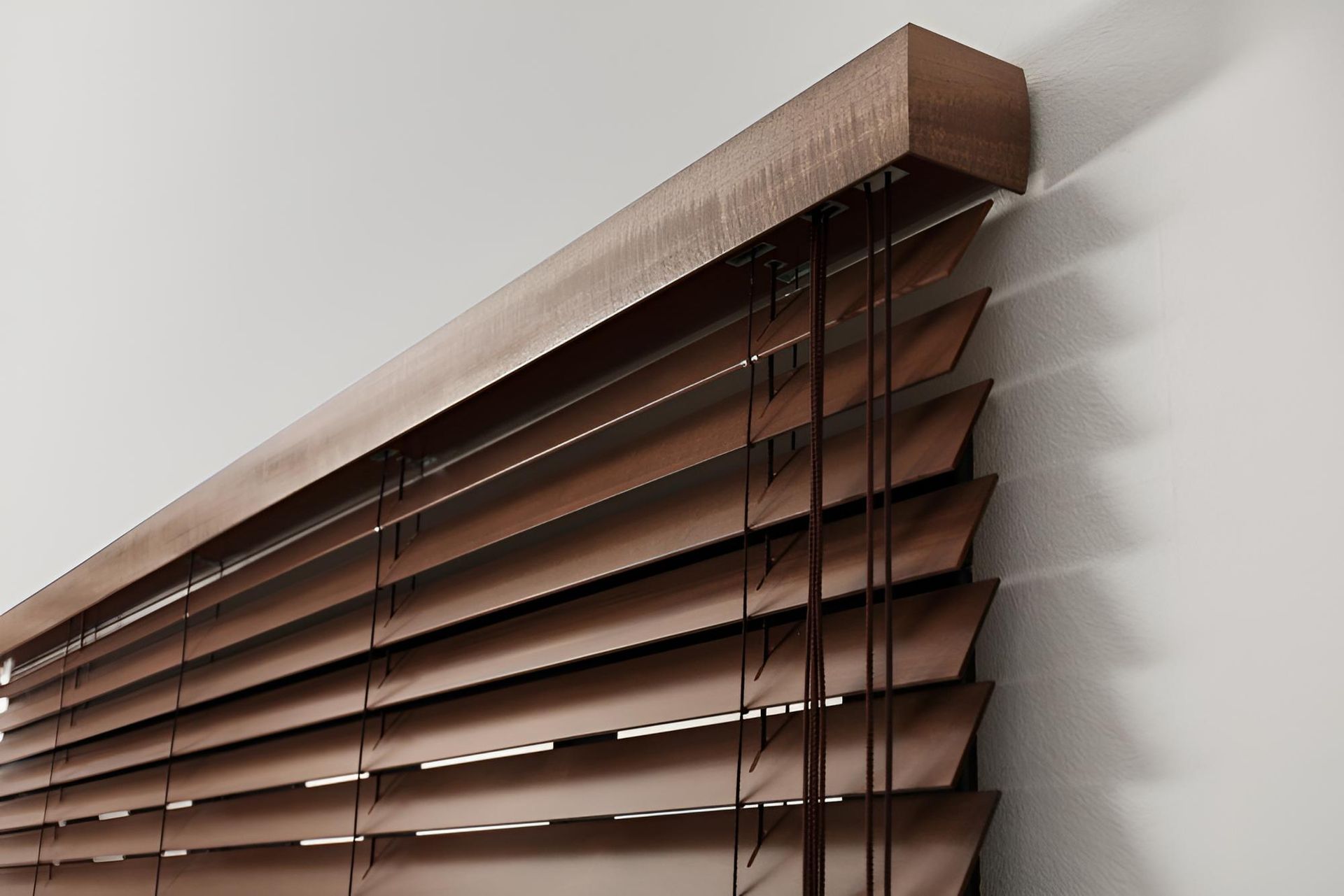 A Close Up of a Wooden Blind on a Window — Lismore Curtains & Blinds In Lismore, NSW