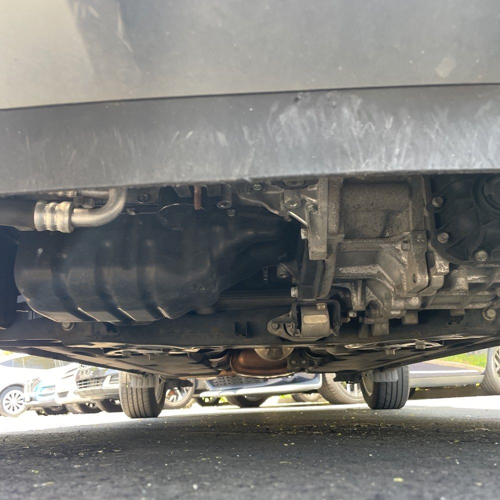 Underside view of a car showing the engine components