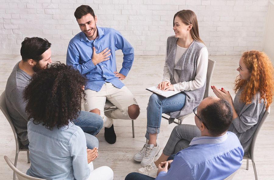 Group Therapy Session: Diverse People in a Circle, Smiling — Thrive Therapy Solutions in Mossman, QLD