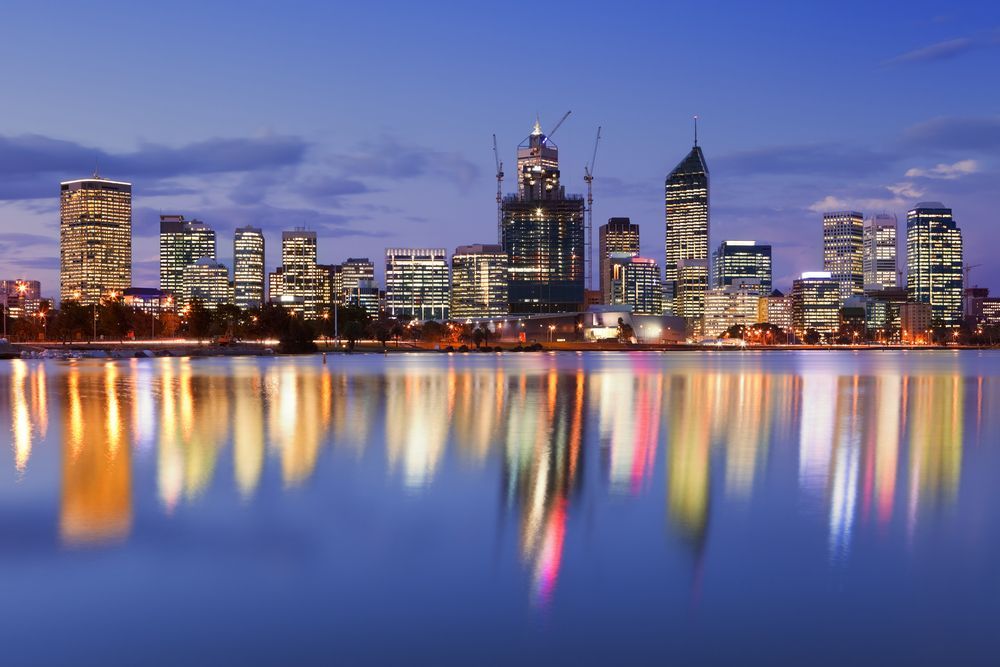A City Skyline is Reflected in a Body of Water — Thrive Therapy Solutions in Innaloo, Wa