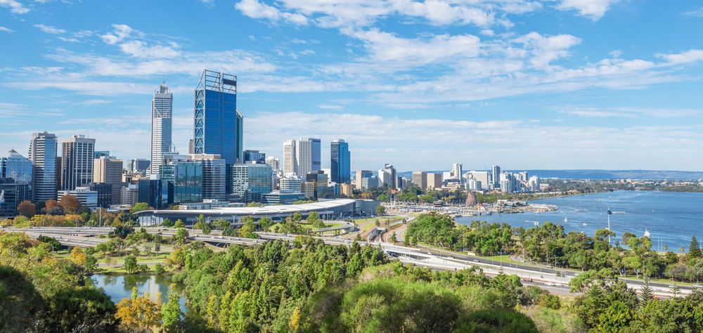 An Aerial View of a City Skyline Surrounded by Trees and a Body of Water — Thrive Therapy Solutions in Wembley Downs, WA
