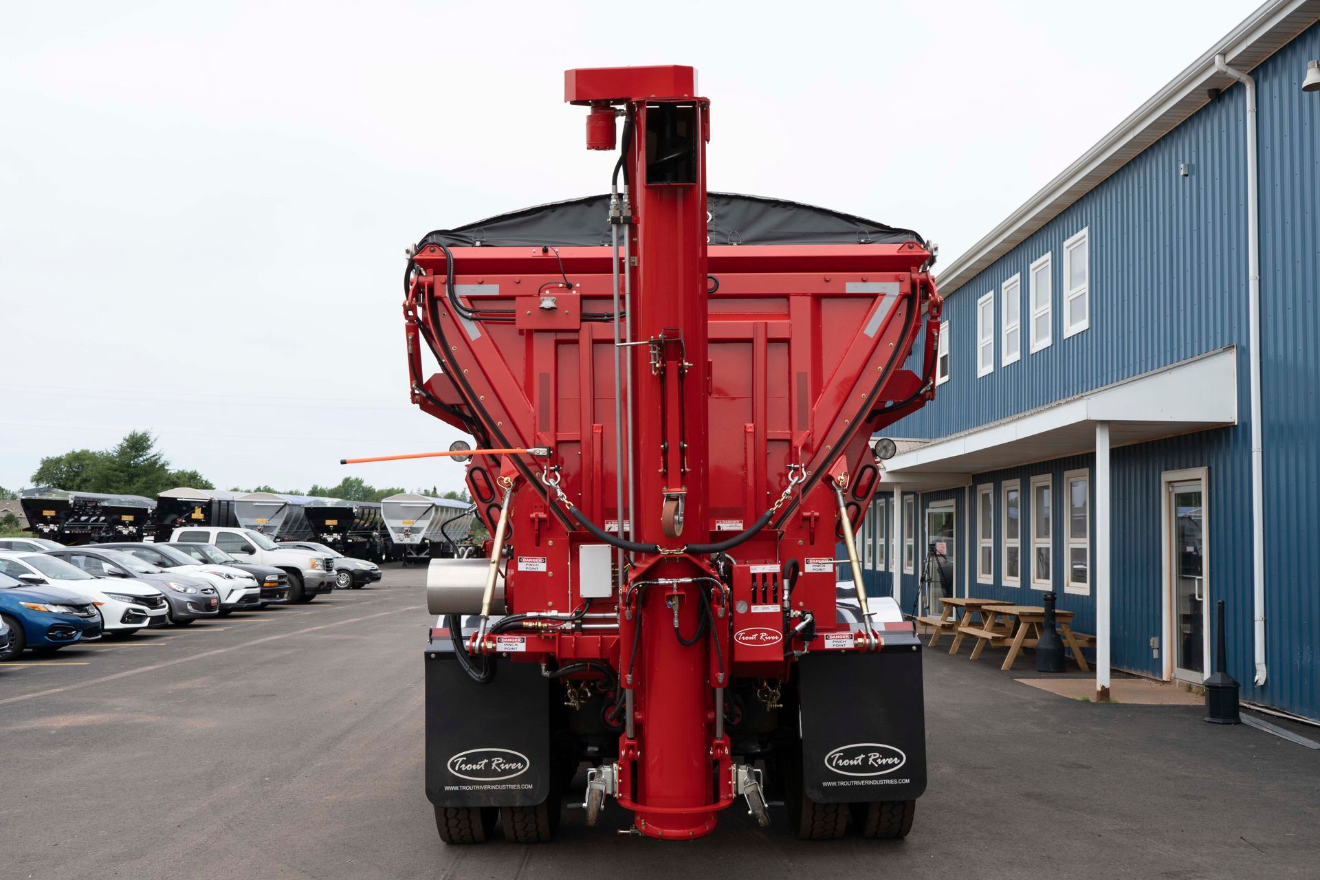 Trout River Industries truck-mounted live bottom auger Transported in the upright position