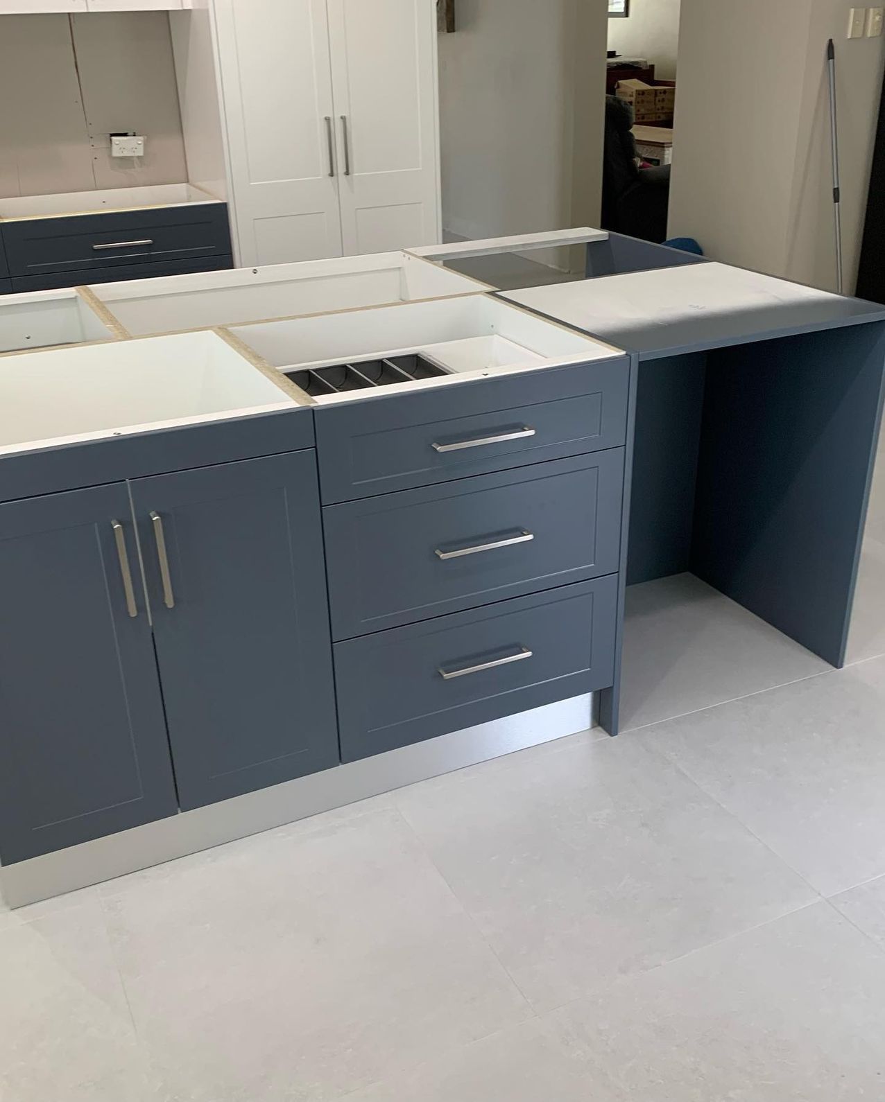 A Kitchen With a Sink, Drawers, Cabinets and a Stove Top Oven — The Kitchen Centre In Wyong, NSW