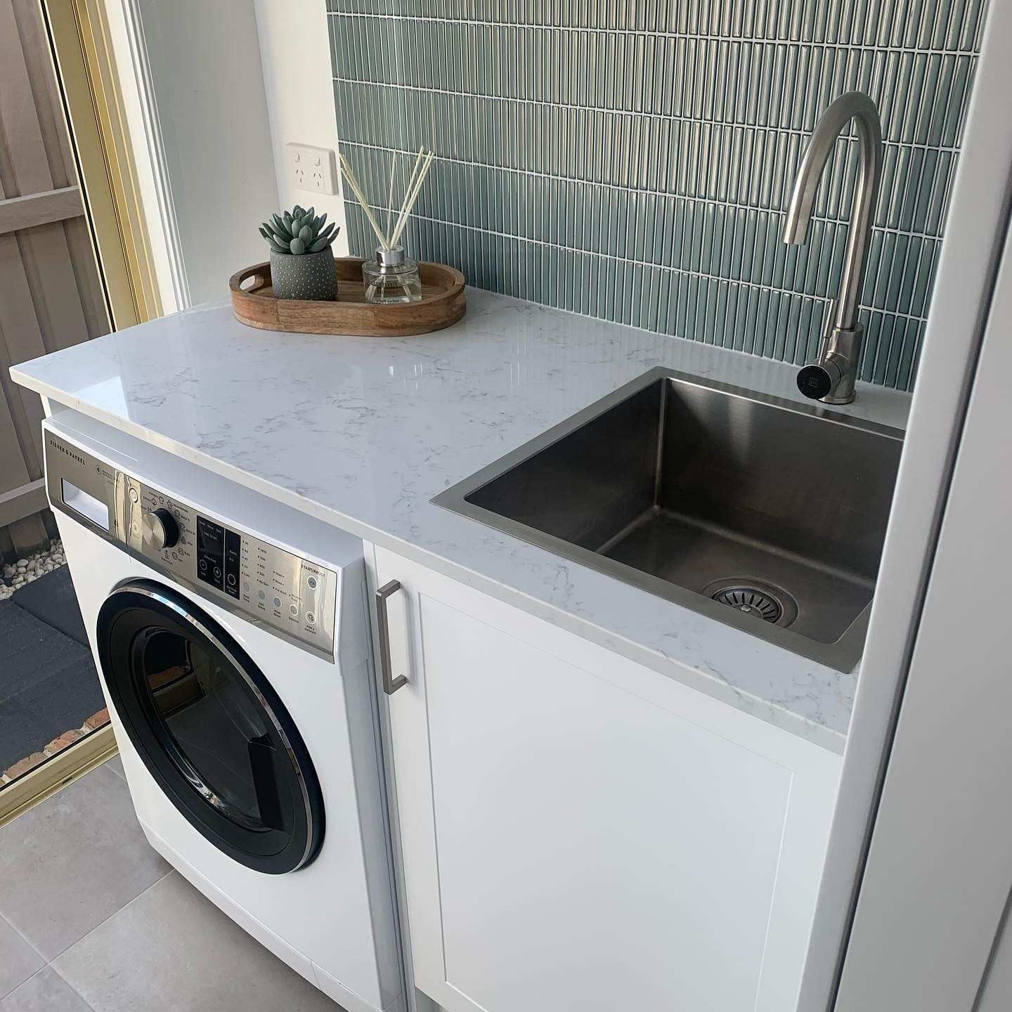 A Laundry Room With a Washer and Dryer and a Sink — The Kitchen Centre In Tuggerah, NSW